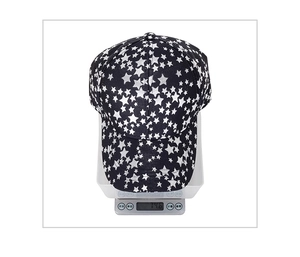 Outdoor star pattern baseball cap weighed on electronic scale showing 74.6g mass