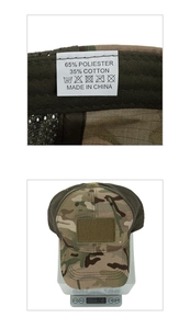 Detail view of the camouflage tactical cap showing fabric labels and weight on digital scale