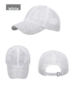 Three-way view of white lace baseball cap featuring floral cutouts and metal buckle