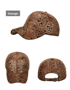 Detail of orange leopard print baseball cap with gold foil outlines and metal buckle