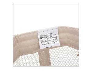 Close-up of baseball cap wash label showing 65% cotton and 35% polyester composition