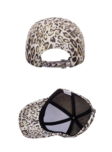 Detail of leopard print baseball cap featuring metal buckle closure and inner lining details