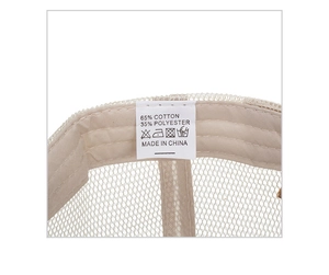 Detail view of cotton and polyester wash label and breathable mesh inside the baseball cap