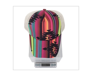 Detailed view of striped baseball cap weighing 70g on an electronic scale for weight check