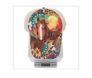Detailed view of horse and sunflower print baseball cap on a scale weighing 71.1g