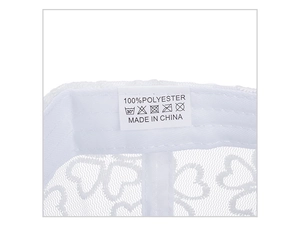 Detail shot of the lace baseball cap washing label showing 100% polyester material