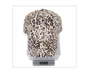 Weight measurement of leopard print baseball cap showing 91.1g on digital scale