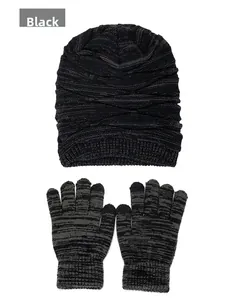 Detail view of winter knitted beanie and glove set with black and grey marled yarn texture