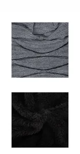Close-up of the grey wave-knit fabric and black thick fleece lining on winter warm accessories
