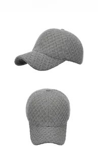 Close-up of grey knitted baseball cap featuring distinct diamond grid texture and soft fabric