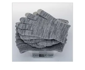 Detail shot of the dark grey knitted hat and gloves set weighing 166.9g on a digital scale