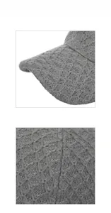 Close-up of gray knitted baseball cap showing thick textured cable knit and visor details