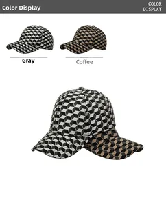 Close-up of baseball cap featuring 3D geometric cube texture in grey and coffee colors