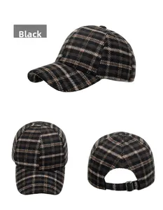 Close-up of black plaid winter baseball cap showing texture and metal adjustment buckle