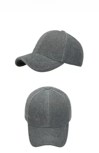 Detail view of the thick faux mink fur fabric texture on a dark grey winter baseball cap