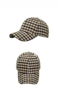 Detail view of plaid winter baseball cap showing thick textured fabric and side profile