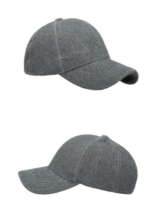 Detail of soft dark grey faux mink fur baseball cap with plush warm winter texture