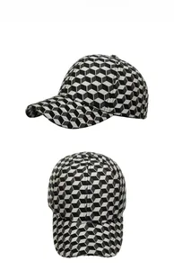 Detail showing the 3D cube geometric pattern and fabric texture of the warm baseball cap