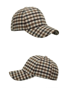 Detailed side view of thick plaid baseball cap featuring wool texture and winter fabric