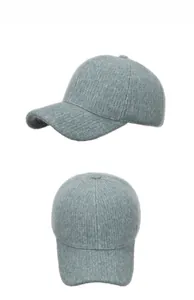 Detailed view of grey-blue knit baseball cap showing plush mohair texture and ribbed patterns