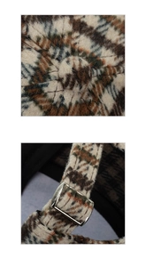 Detailed close-up of plaid baseball cap texture and adjustable metal buckle strap