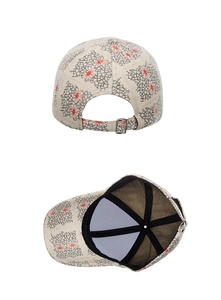 Detail of adjustable metal buckle and inner seam reinforcement on patterned baseball cap