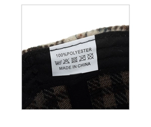 Detailed close-up of winter baseball cap interior featuring 100% polyester wash label
