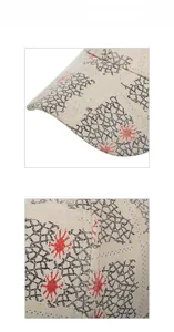 Close-up of beige baseball cap featuring black mesh patterns and red star motifs
