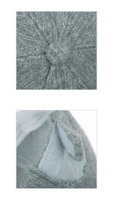 Detail of knitted beanie showing top stitching craftsmanship and inner adjustable band