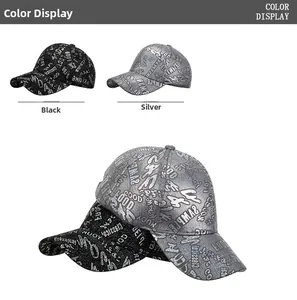 Detail of laser graffiti pattern on shiny metallic finish baseball caps in black and silver