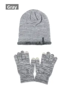 Detail view of grey knit beanie with faux fur lining and touchscreen gloves set