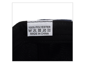 Detail view of the interior washing label showing 100% polyester material for baseball cap