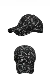 Close-up of black baseball cap with white artistic graffiti letters and street style design