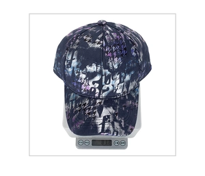 Detail shot of a holographic graffiti baseball cap weighing 83.8g on a digital scale