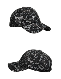 Detailed close-up of a black baseball cap featuring silver glitter graffiti art and letters