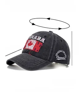 Detail of Canada maple leaf embroidery on dark grey washed cotton baseball cap