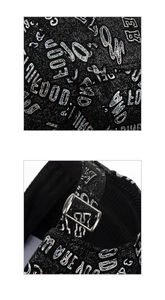 Close-up of black glitter baseball cap with silver holographic letters and metal buckle