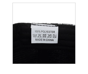 Detail view of the inner black polyester fabric and care label of this baseball cap