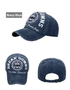 Navy blue washed retro baseball cap featuring detailed circular embroidery and metal buckle