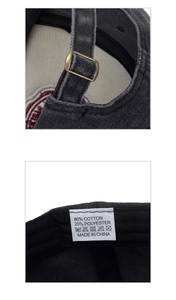 Detail of adjustable bronze metal buckle and inner fabric material label on washed cotton cap