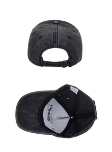 Detail view of washed cotton baseball cap showing adjustable strap and inner sweatband