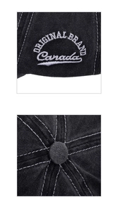 Close-up of Canada maple leaf embroidery and contrast stitching on black washed cotton cap