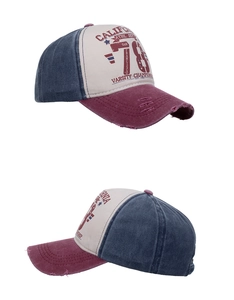 Detailed views of vintage washed cotton baseball cap with worn edges and letter print