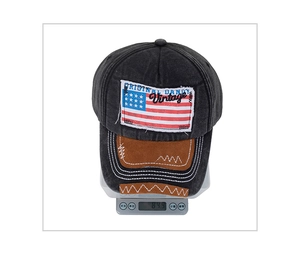 Detail view of vintage washed cotton baseball cap with US flag patch weighing about 84.9g