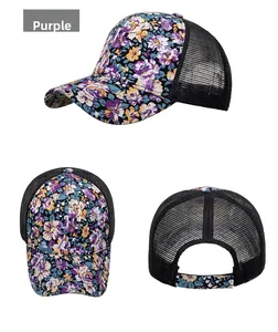 Detail view of purple floral print trucker hat with breathable black mesh back and snap closure