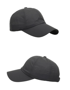 Detail of dark grey breathable laser-cut mesh holes on lightweight sports baseball cap
