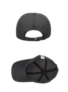 Detail view of breathable mesh texture and adjustable metal buckle on black baseball cap
