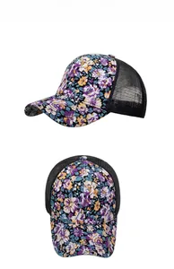 Detailed side and front view of a floral mesh trucker hat with breathable net back