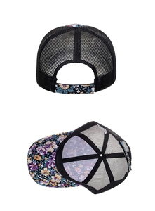 Close-up of floral mesh trucker hat showing breathable mesh and adjustable strap back