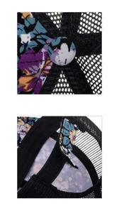 Close-up of mesh fabric and adjustable hook and loop strap on floral baseball cap